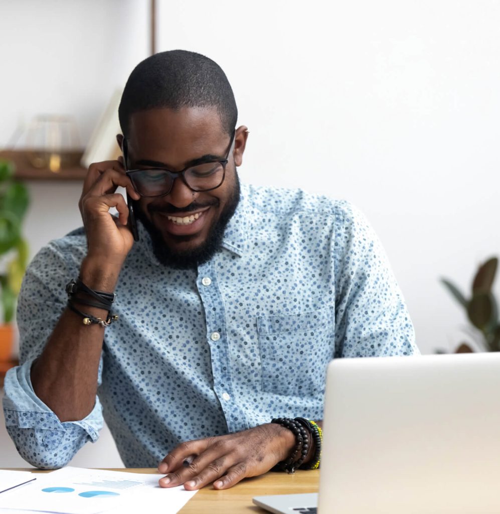 man talking on cell phone and smiling