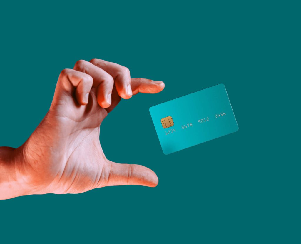 hand grabbing blue credit card